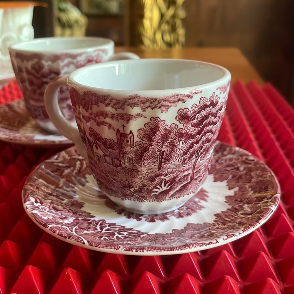 A LOVELY PAIR OF RED JON ROTH TEACUPS AND SAUCERS